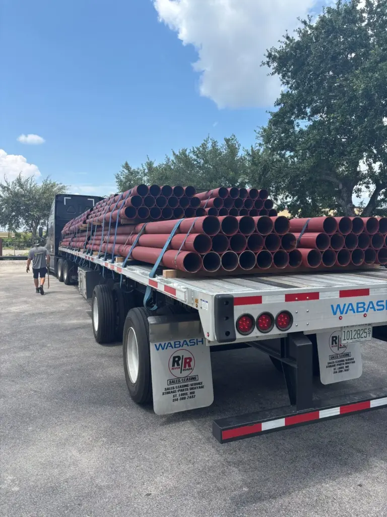 Steel Pipe Bollards 2 Primed steel pipe for bollards loaded on a flatbed trailer